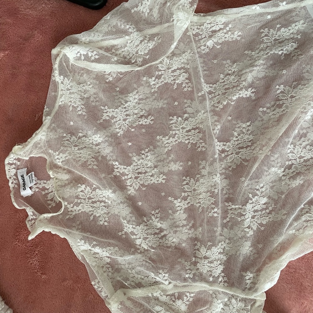 Long sleeve lace mockneck top.